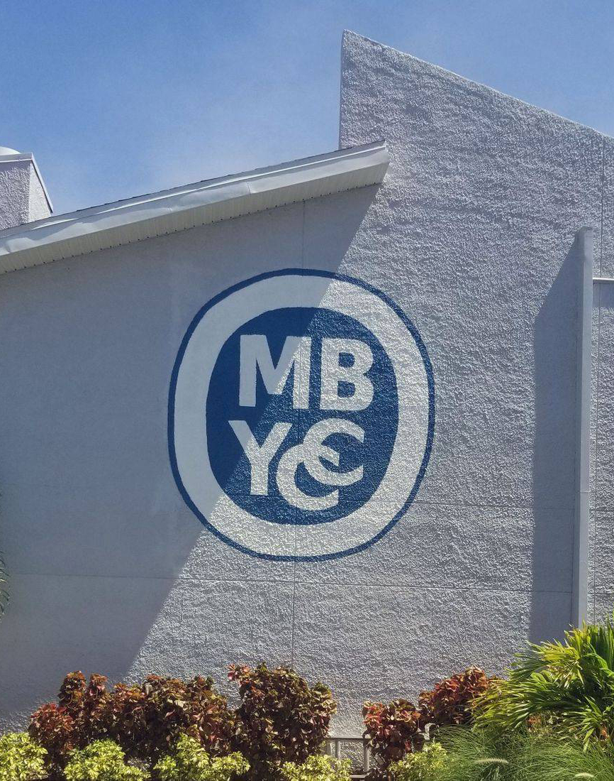 MB YCC Logo in Blue and White Color Painted on a Cement Wall