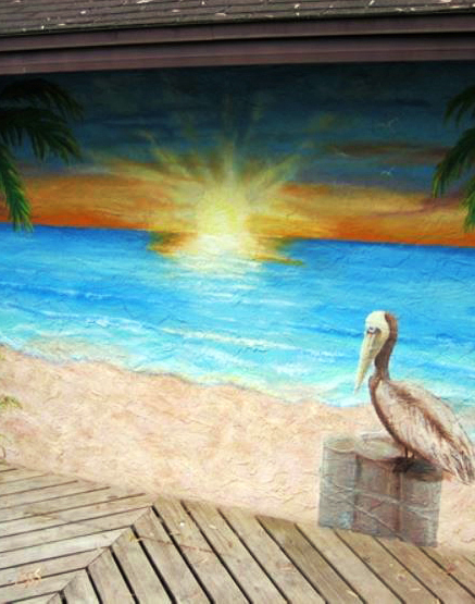 Sun Rise Over a Beach With a Crane Sitting on a Log