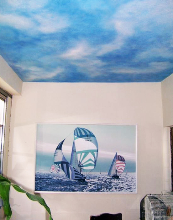 A Wall Painted With Sky Pattern and a Sea Themed Wall Painted